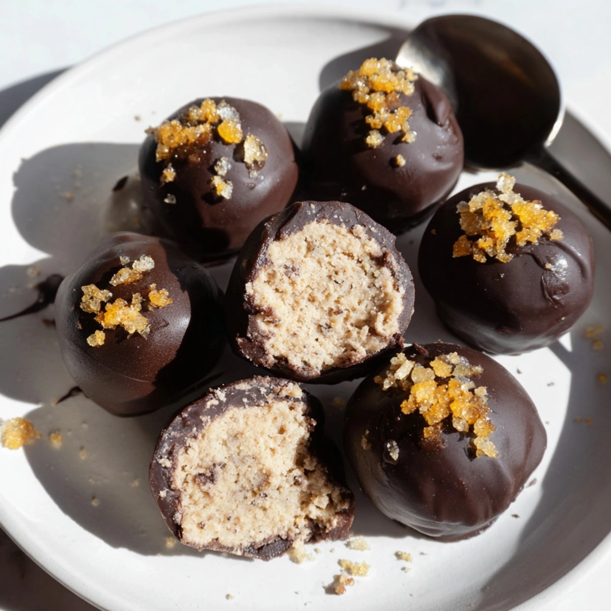 Close-up of decadent Cinnamon Ginger Ricotta Truffles, chocolate coated and spiced, ready to serve.
