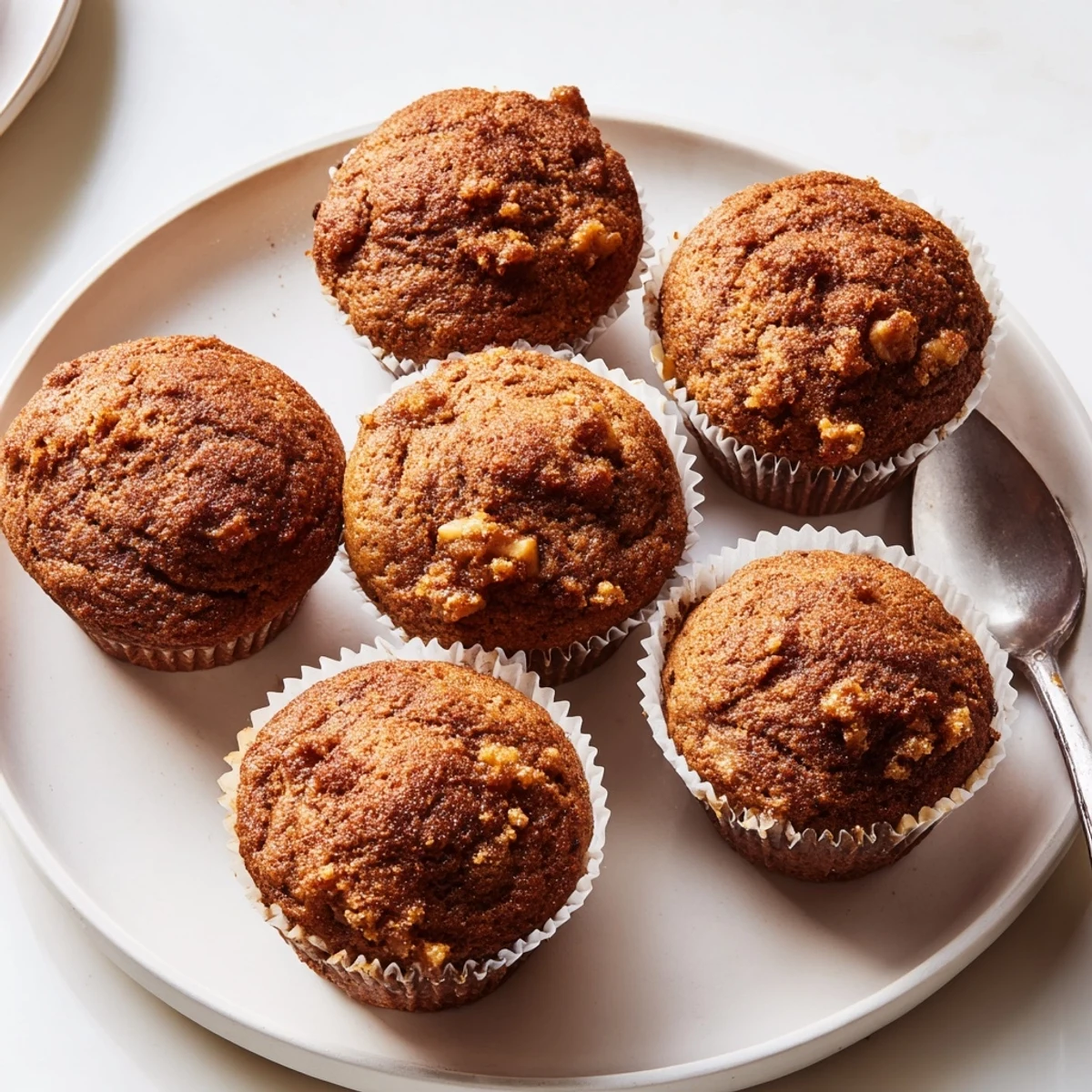 Deliciously soft pumpkin muffins infused with ginger, perfectly paired with hot coffee or chai.