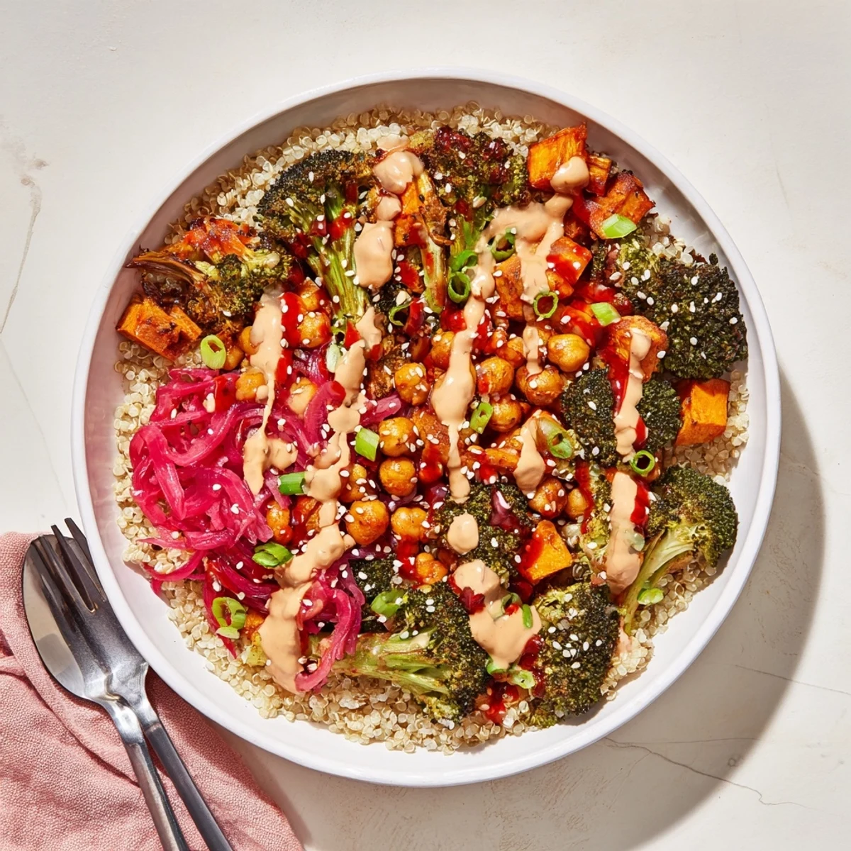 Colorful grain bowls featuring chickpeas, miso-butter, and gochujang-maple sauces.