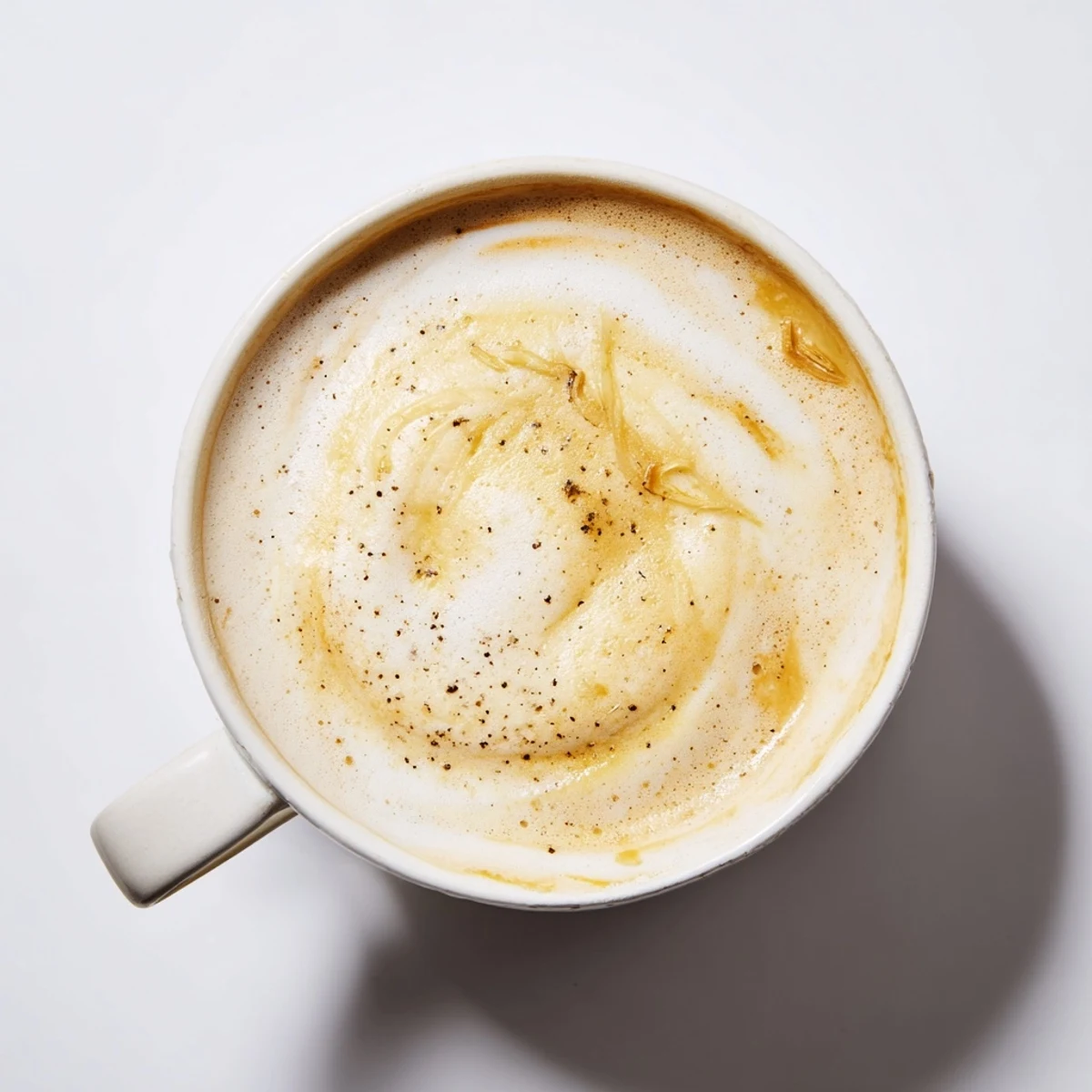 Unconventional onion latte showcasing creamy textures and caramelized flavors in every sip.  