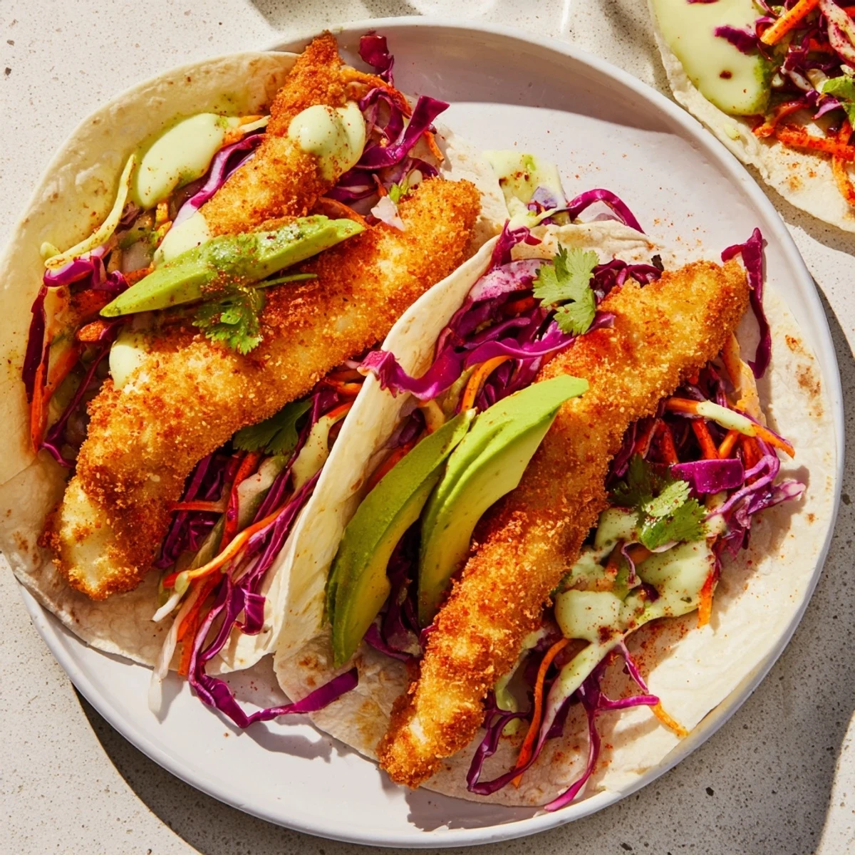 Golden, crunchy Crispy Fish Tacos with fresh slaw ready to enjoy, a delicious, vibrant meal.