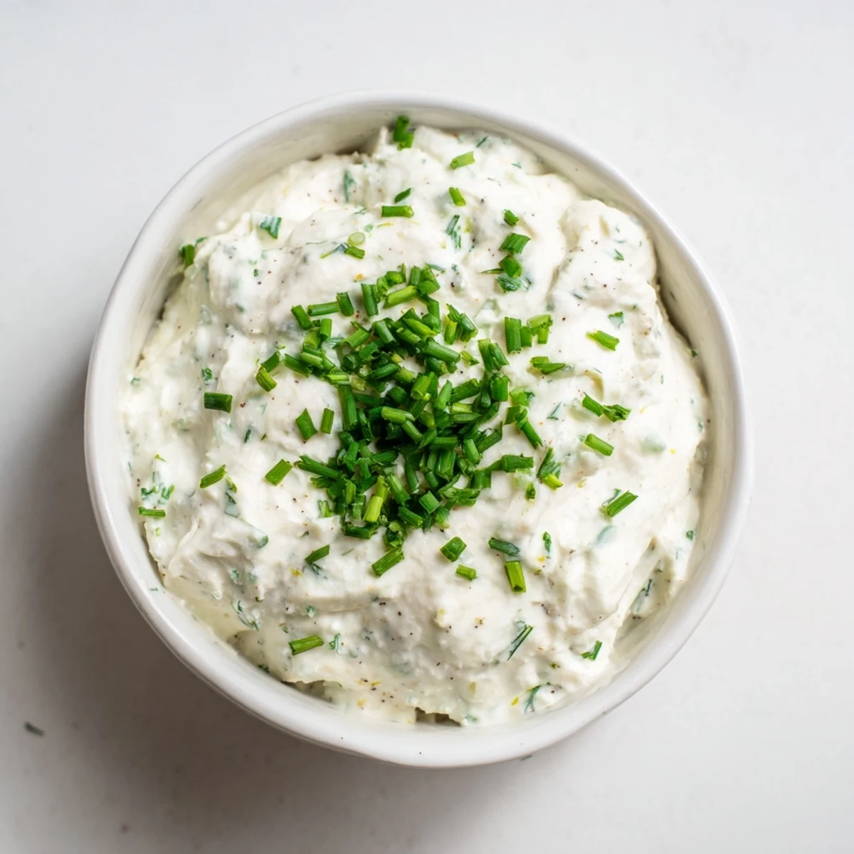 Creamy Veggie Ranch Dip with bright green chives, perfect with carrot sticks and crunchy celery.