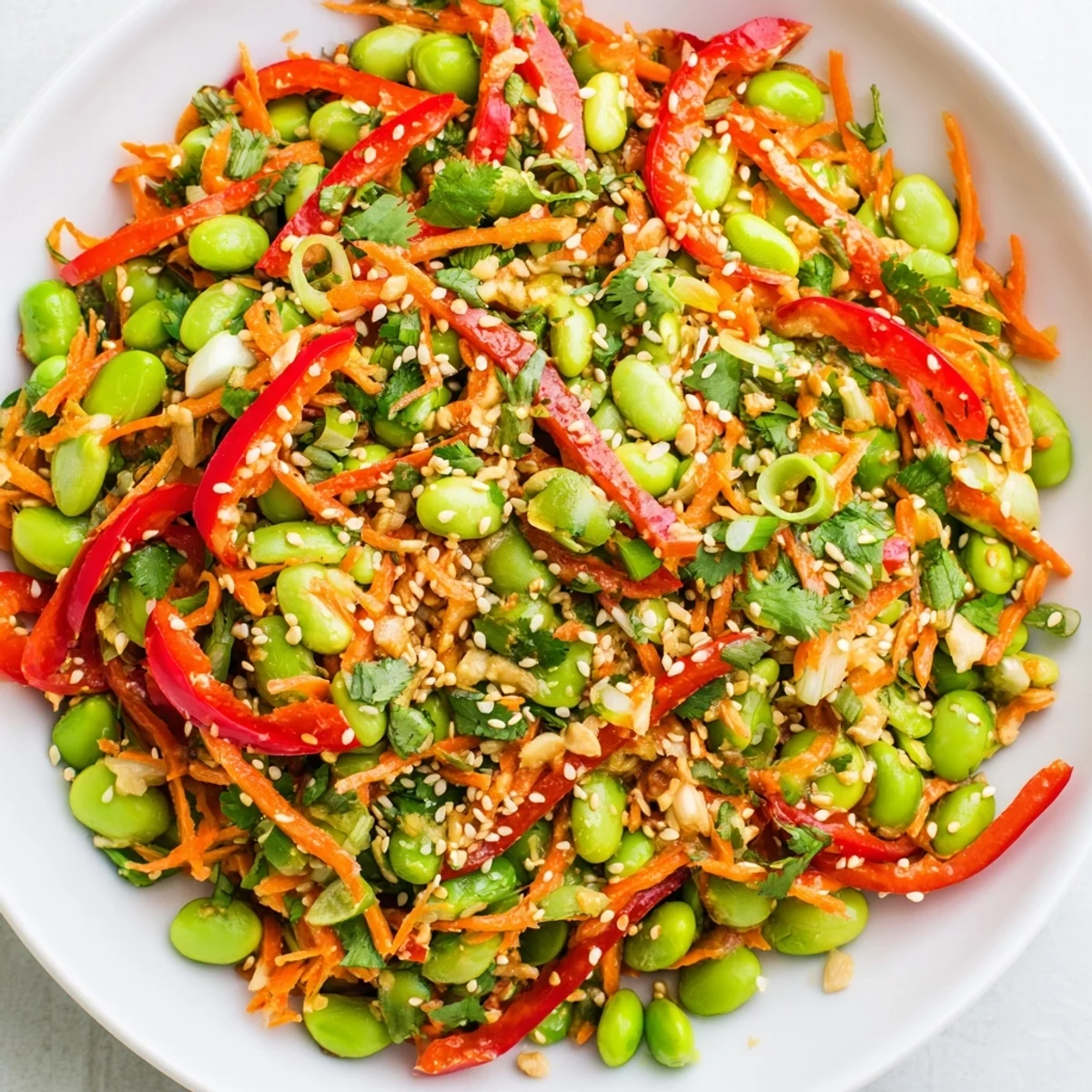 A refreshing Asian edamame salad, featuring colorful veggies and a savory ginger dressing, ready to enjoy.