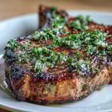 2. Pan-seared lamb chops drizzled with fresh gremolata, adding vibrant flavor and color to a classic Italian main dish.  
