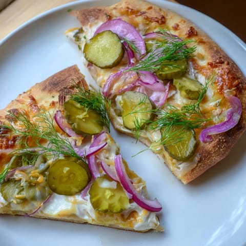 Savor the unique flavors of this Pickle Pizza, with a rich creamy finish.  