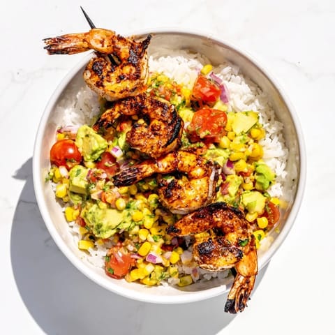 Vivid image of fresh Easy Grilled Shrimp Bowls topped with colorful salsa, perfect for a light summer meal.