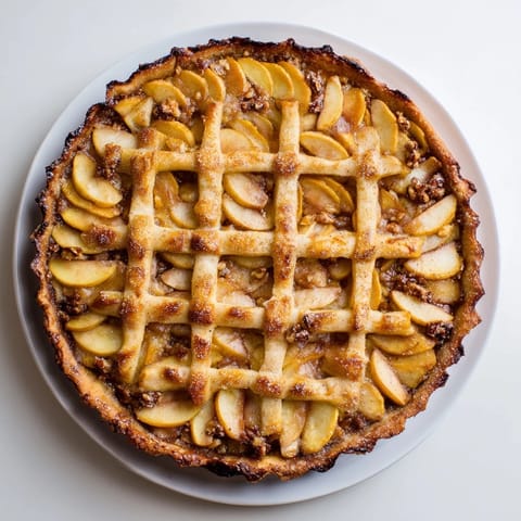 This delicious Lattice Orchard boasts golden, baked apples in an elegant lattice design with honey.