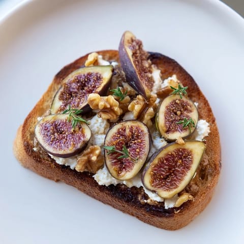 Close-up of the Royal Tapestry, showing the decadent layering of pâté, goat cheese, and glistening fig slices.