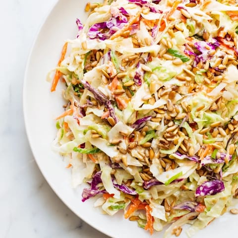 A fresh, colorful Crunchy Coleslaw Salad is perfect for summer barbecues alongside grilled chicken.