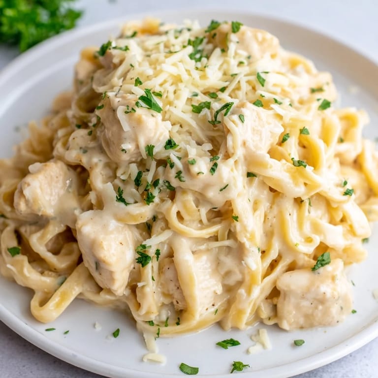 Imagine a cheesy, bubbling Chicken Fettuccine Alfredo bake, a comforting Italian-American favorite dish.