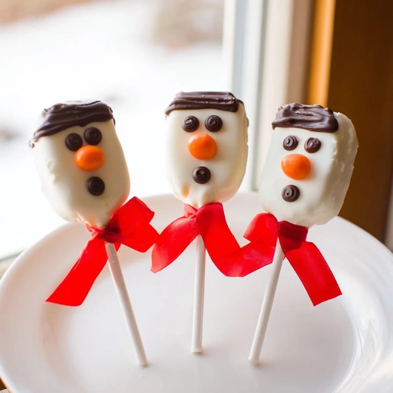 Enjoy these easy-to-make Express Snowman Marshmallow Pops, a delicious cold-weather dessert for everyone to savor.