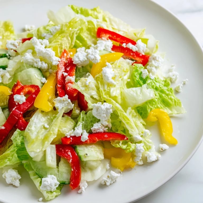 Fresh Bella Hadid Salad with creamy feta, crisp veggies, and a bright lemon dressing ready to enjoy.