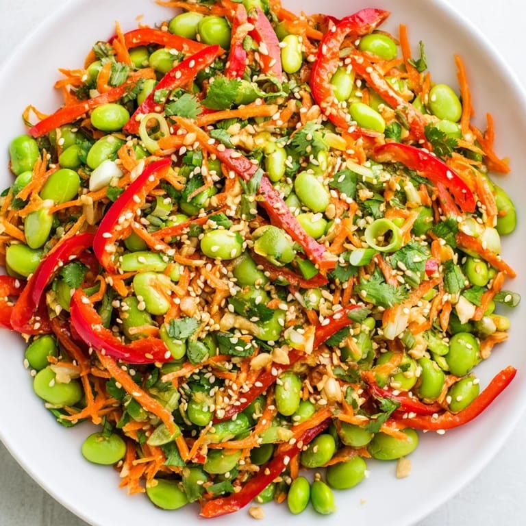 A refreshing Asian edamame salad, featuring colorful veggies and a savory ginger dressing, ready to enjoy.