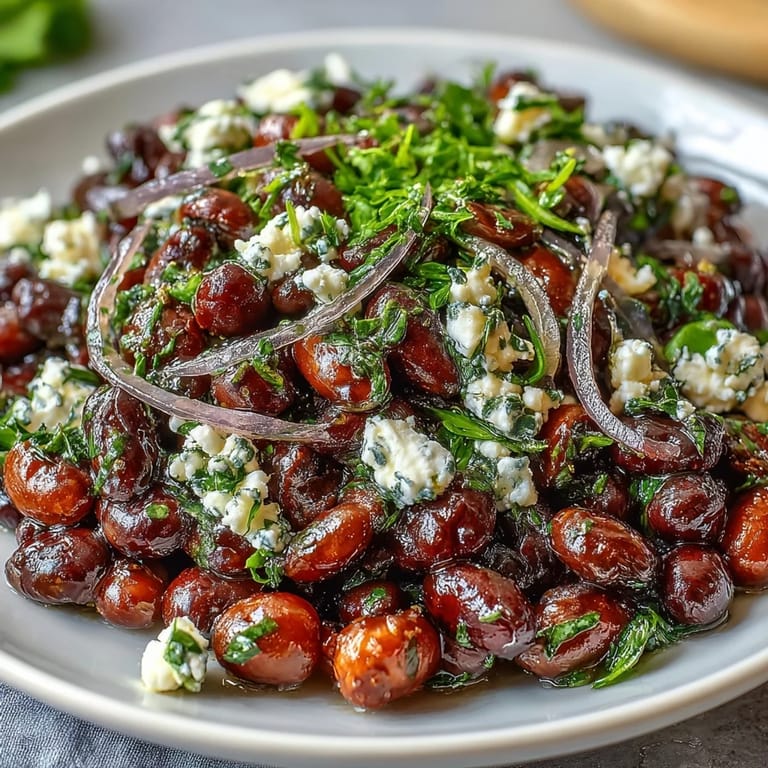 Tangy dressing coats chickpeas and black beans in this chilled Mediterranean Divorce Salad, ready to enjoy with a fork for a refreshing lunch.