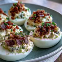 Creamy Bacon Ranch Deviled Eggs with crispy bacon and fresh chives, a flavorful appetizer perfect for Easter or any party.